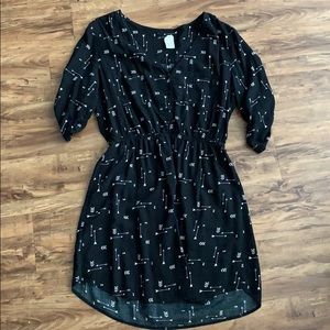 Women’s black dress with arrows